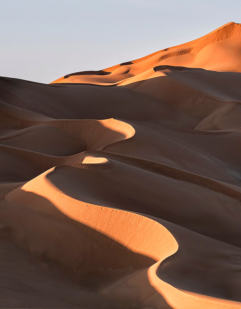 Sand dunes at sunset in the Rub al Khali desert, Oman, Middle East