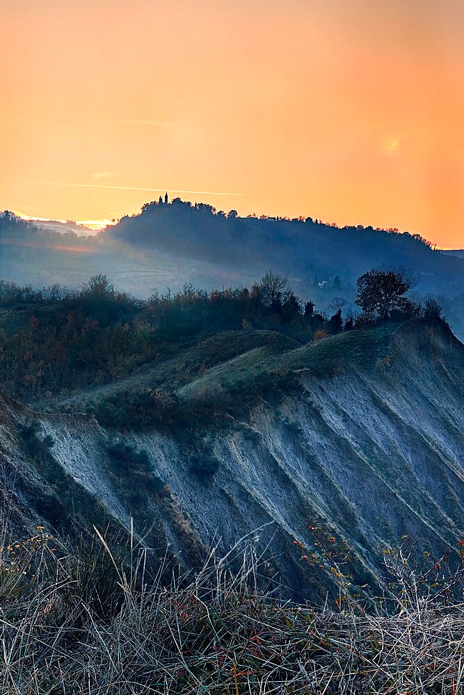 Orange sunset on badlands, Emilia Romagna, Italy, Europe