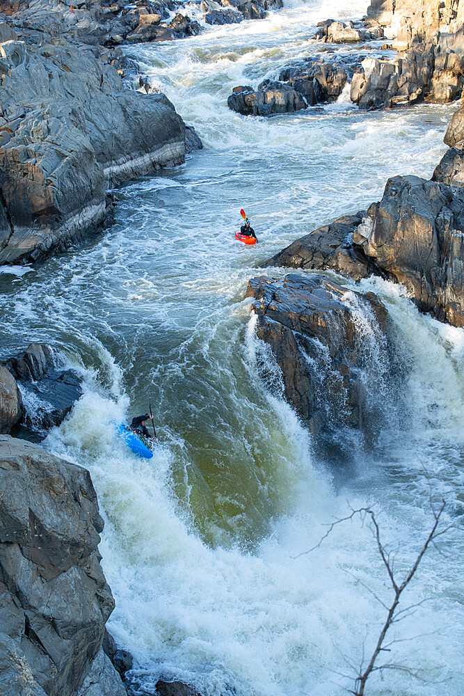 Kayaker Ian Brown heads off the Spout, the last drop of Great Falls of the Potomac River, Virginia, United States of America, North America