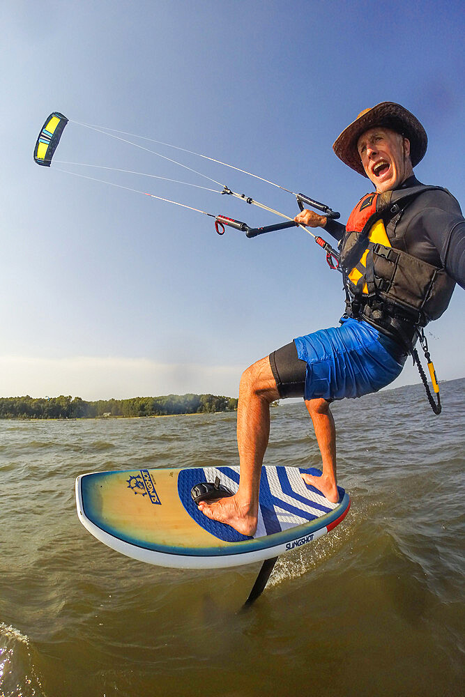 Photographer Skip Brown on his foiling kiteboard on the Chesapeake Bay near Annapolis, Maryland, United States of America, North America