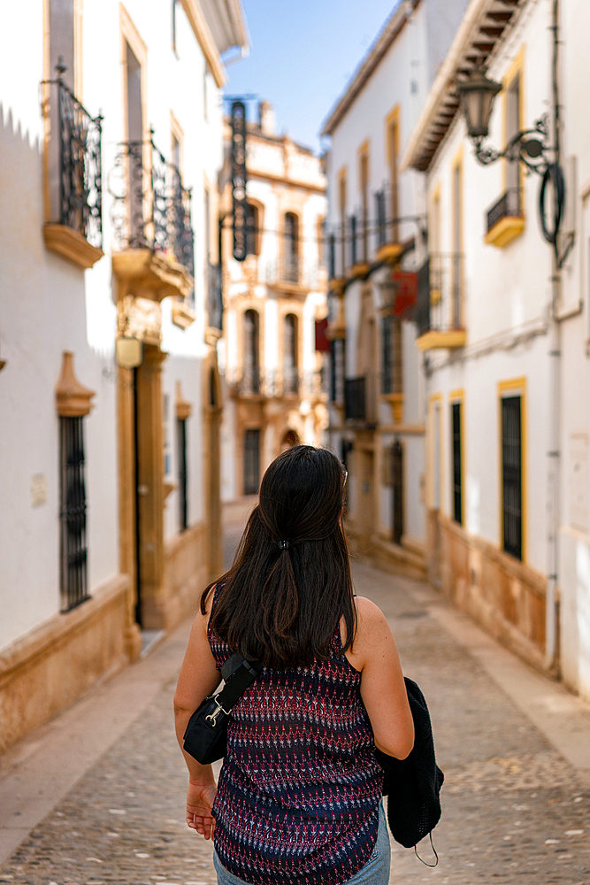 Woman in street of historic white village, Ronda, Pueblos Blancos, Andalusia, Spain, Europe