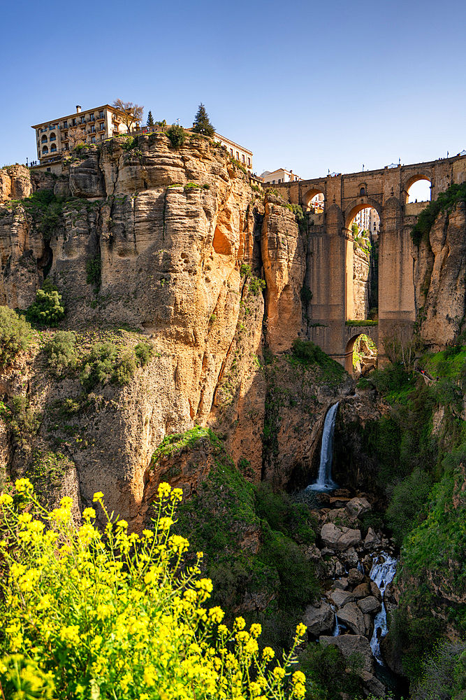 Beautiful bridge and waterfall and traditional white village of Ronda, Pueblos Blancos, Andalusia, Spain, Europe