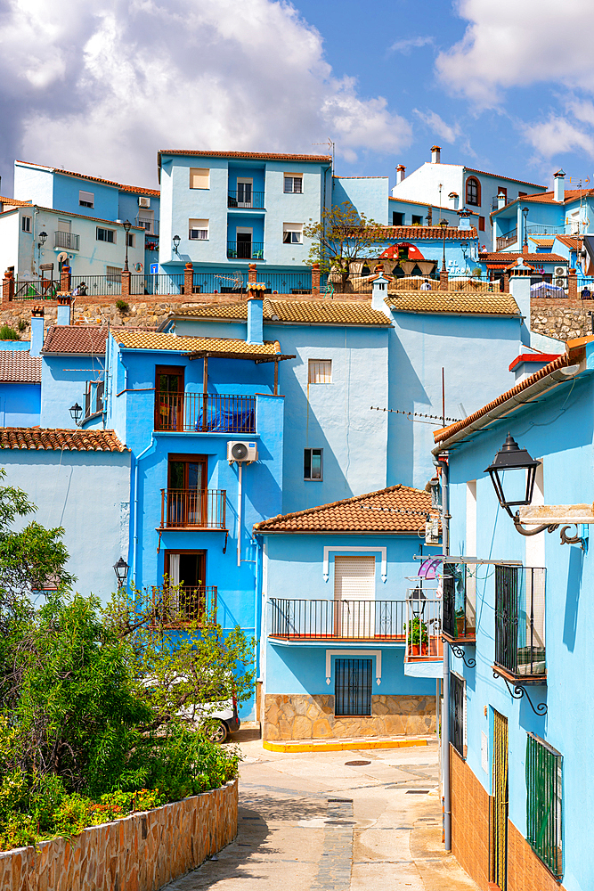 Village street in blue painted Smurf house village of Juzcar, Pueblos Blancos region, Andalusia, Spain, Europe