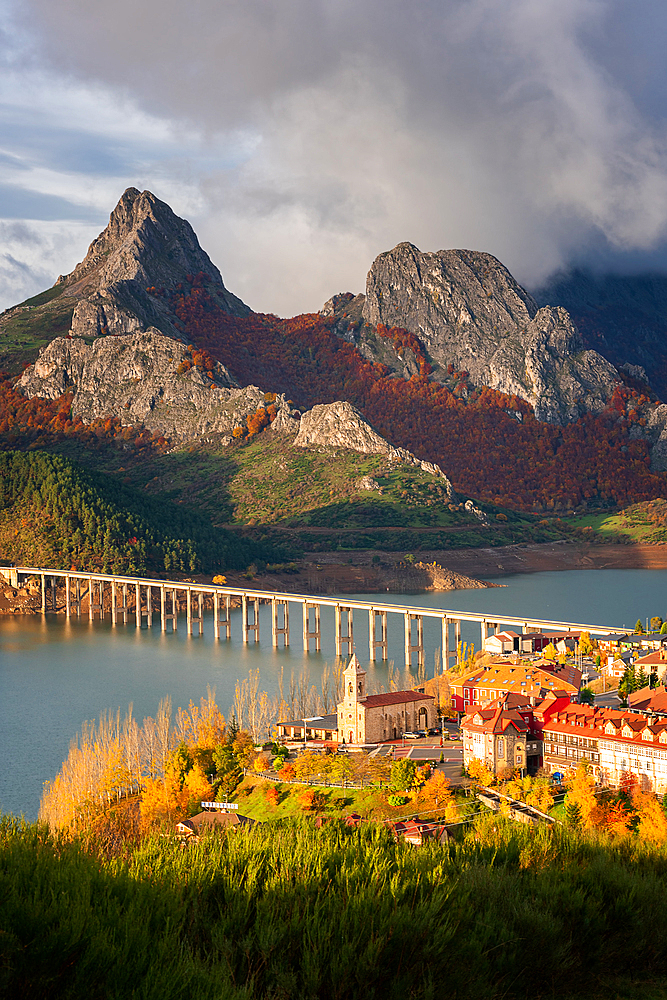 Riano cityscape at sunrise with mountain range landscape during autumn in Picos de Europa National Park, Leon, Spain, Europe