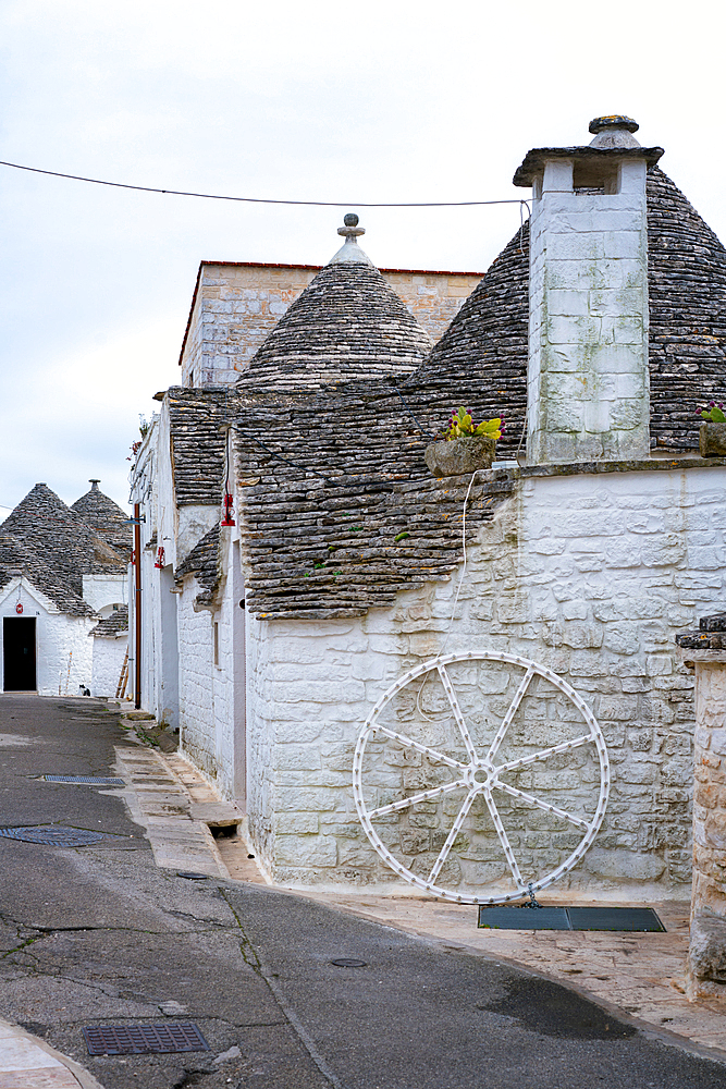 Alberobello iconic old Trullo and Trulli white houses with stone ceilings in conic shape, in Italy