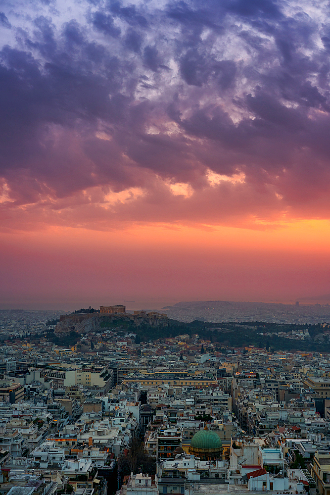 Athens city at sunset with Parthenon and Acropolis seen from Lycabettus hill viewpoint in Greece