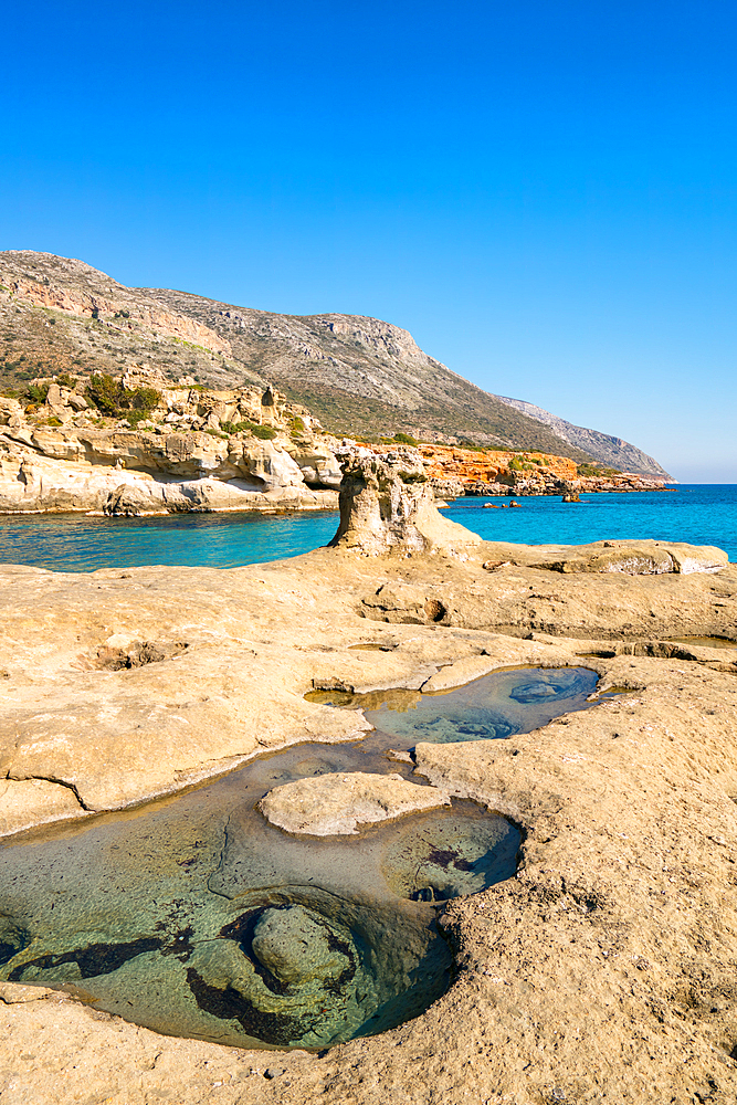 Petrified forest Agia Marina Agios Nikolaos Geopark beach with turquoise water in the south of Greece