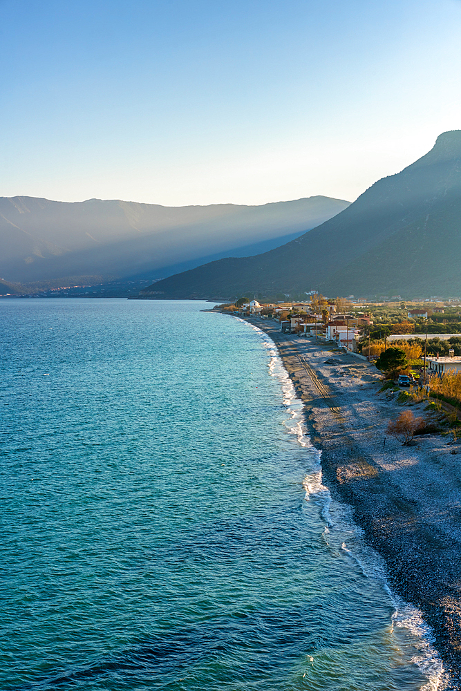 Lakkos beach with turquoise water and mountains in the background, in Greece