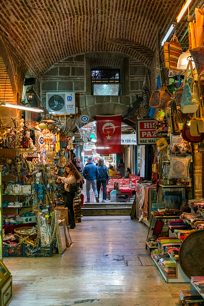Street inside Izmir Kemeralti bazaar market full with souvenir shops in Turkey