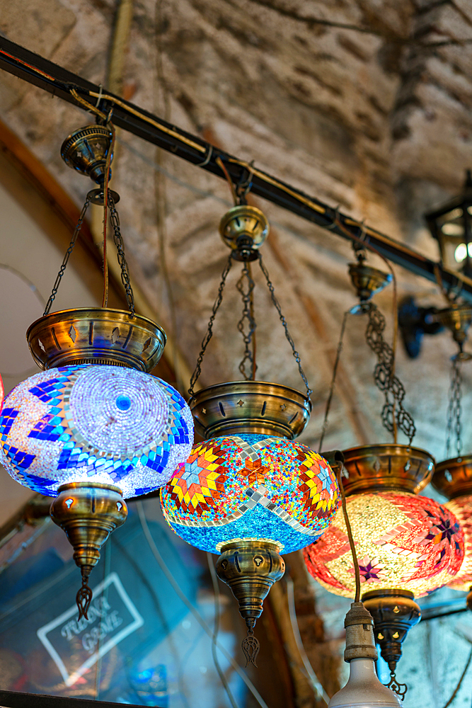 Turkish traditional colorful mosaic lamp chandeliers on a bazaar market in Izmir, Turkey