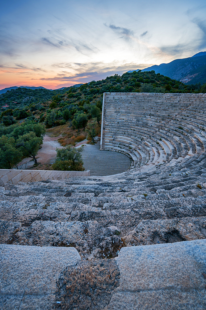 Ancient theater of Antiphellos ancient city at sunset in Kas, Turkey