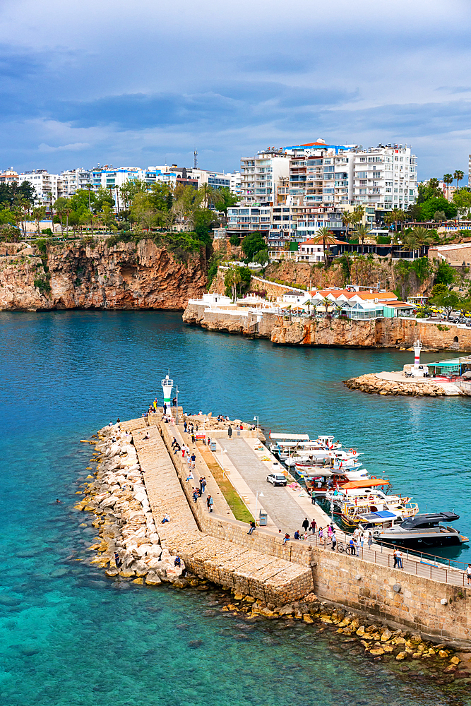 Antalya city and port view with boats in the marina in turquoise water in Turkey