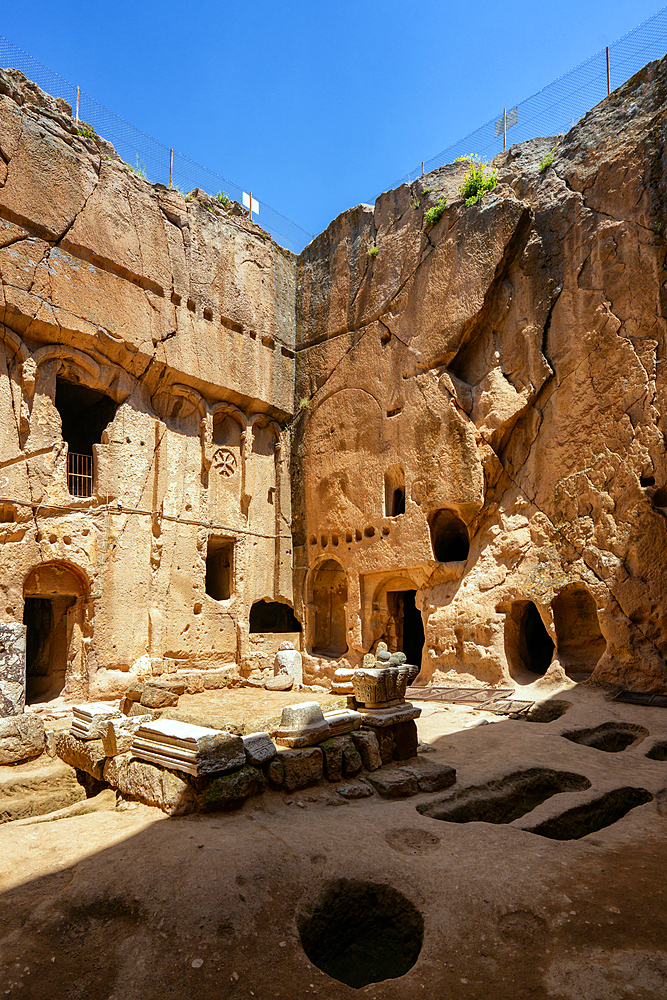 Gumusler ancient monastery with caves on the rock in Turkey