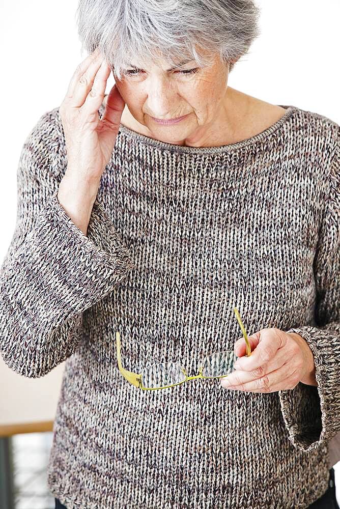 Elderly person with headache