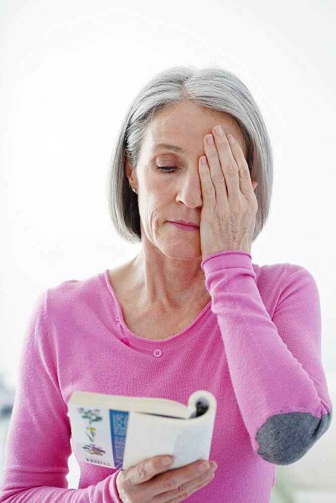 Elderly person reading