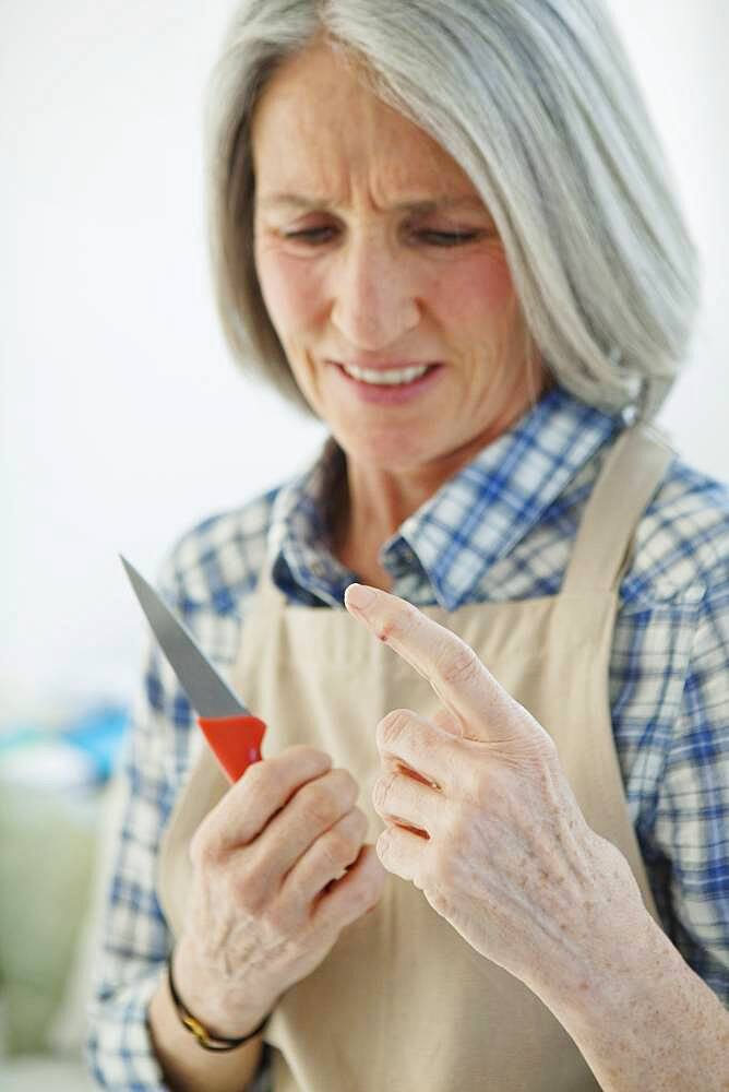 Elderly person in  kitchen