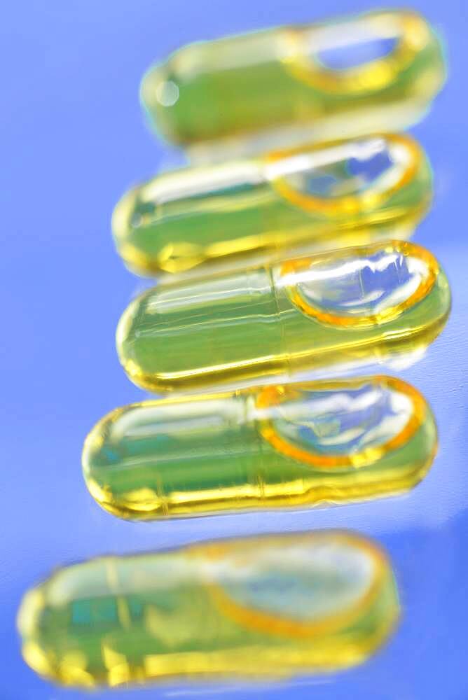 Capsules of cod liver oil. Cod liver oil is consummed mainly for its richness in vitamin A and D, but it also contains omega 3.