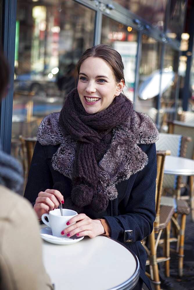 Women drinking coffe at a terrace.