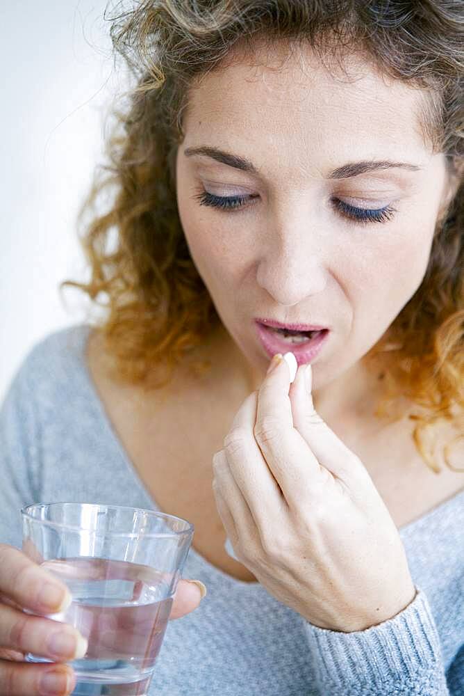 Woman taking medication