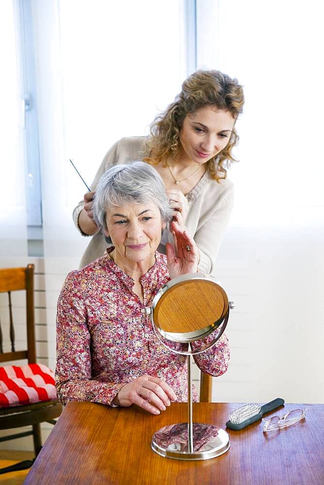 Senior woman with her carer.