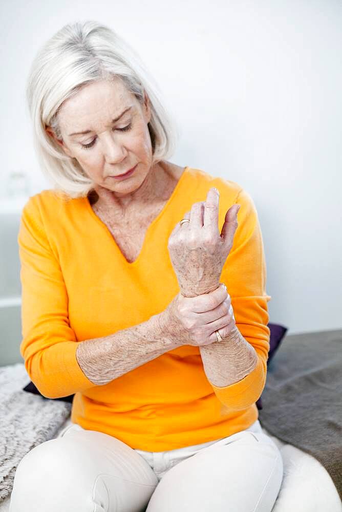 Senior woman with wrist pain.