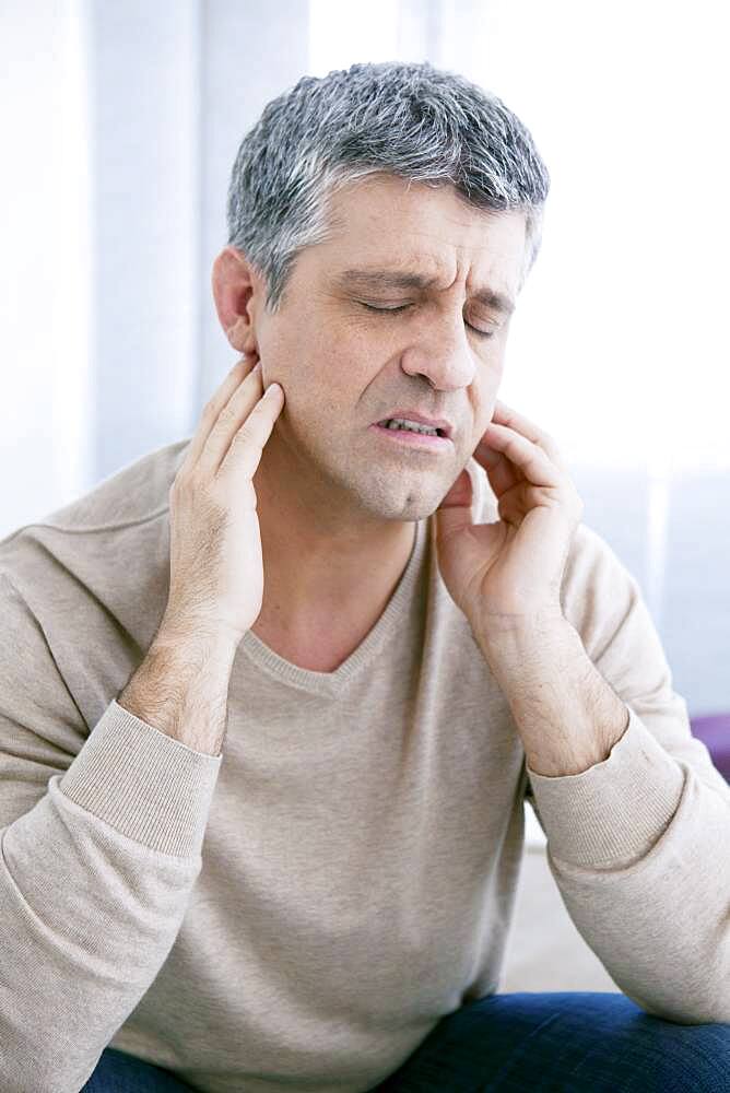 Man with earache.