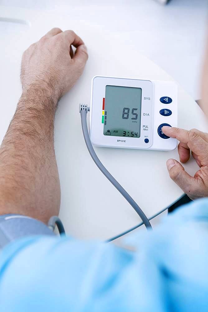 Man measuring his blood pressure.