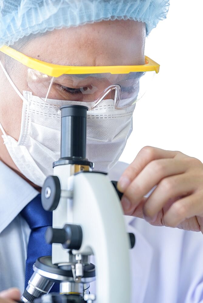 Asian young man student scientist researching and learning in a laboratory.