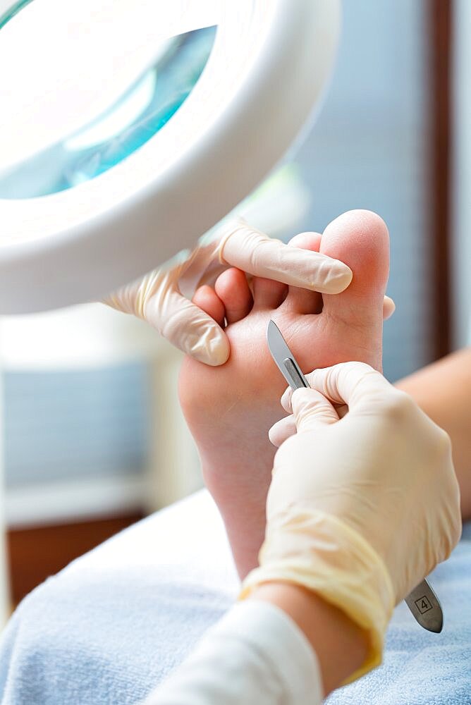 Woman receiving podiatry treatment in a Day Spa.