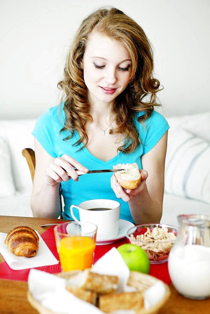 Woman eating breakfast