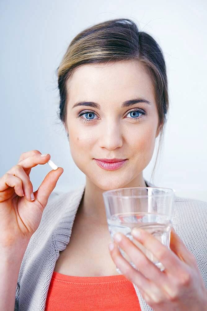 Woman taking medication