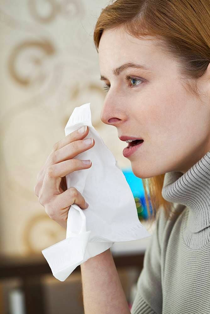 Woman sneezing