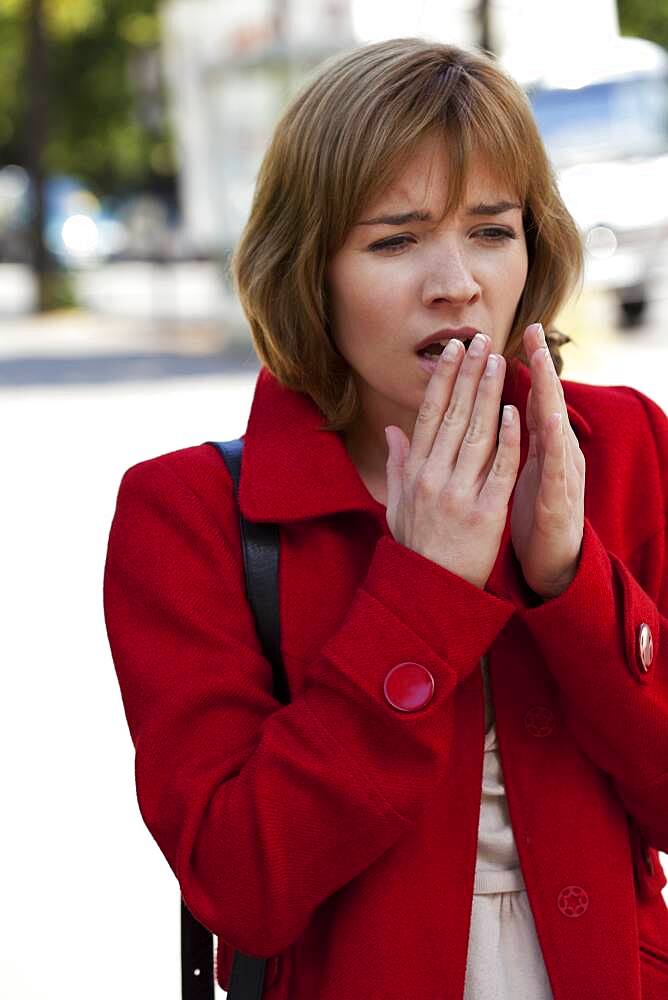 Woman sneezing
