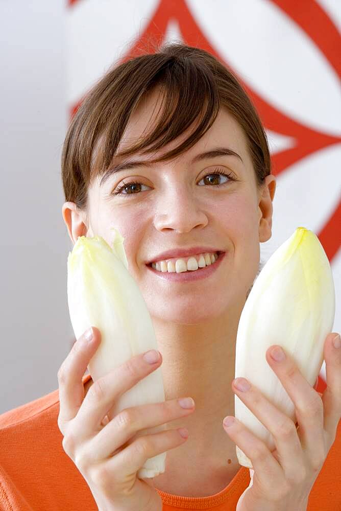 Woman eating raw vegetables