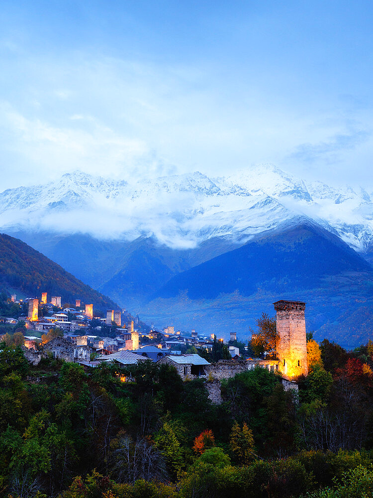 View of the typical Svaneti towers at blue hour in Mestia, Samegrelo-Upper Svaneti, Georgia (Sakartvelo), Central Asia, Asia