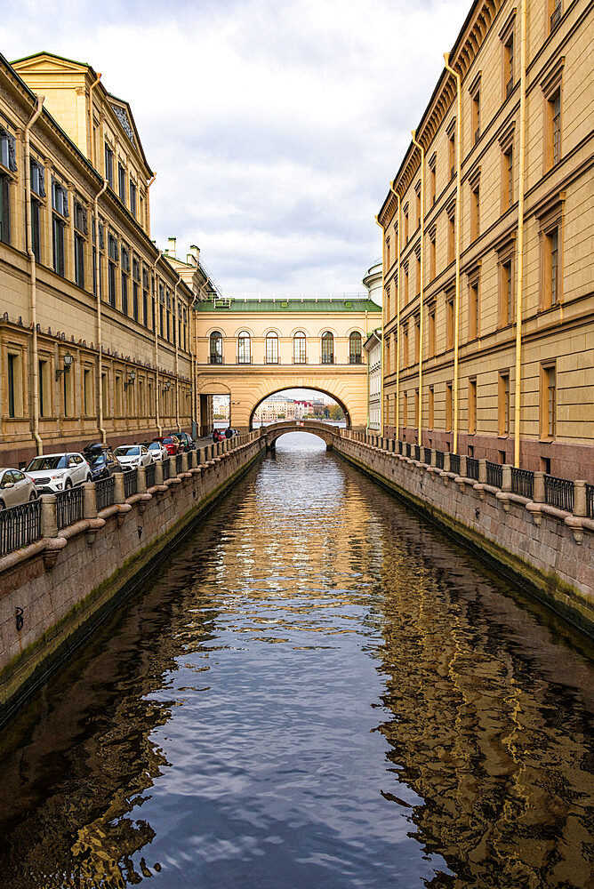 View towards Hermitage Bridge over Zimniaya Kanavka (Winter Canal), and Neva River beyond, St. Petersburg, Russia, Europe