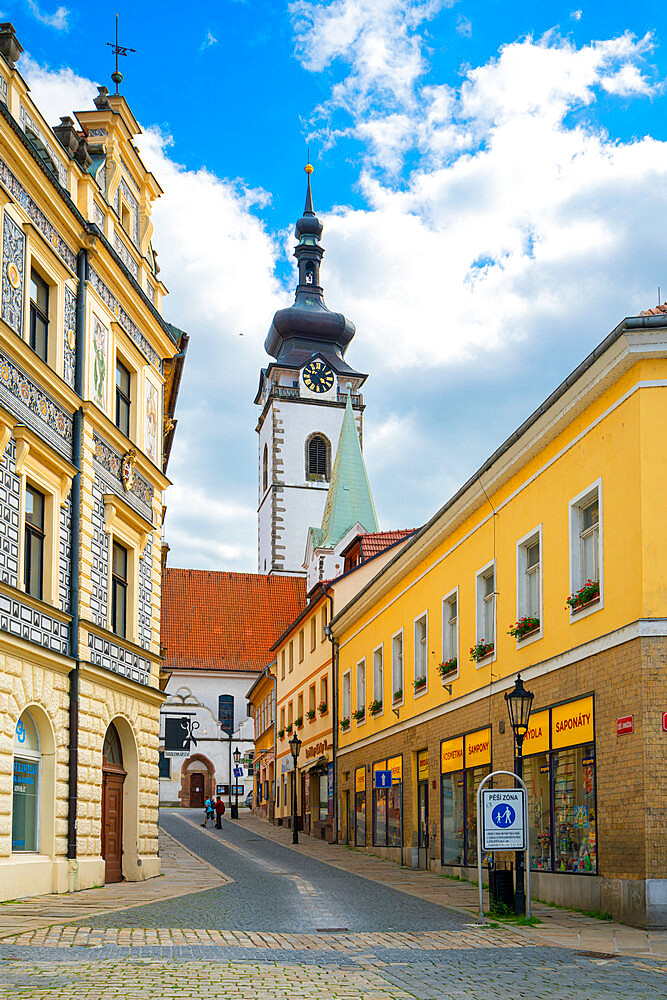 Street leading to Church of the Nativity of the Blessed Virgin Mary on sunny day, Pisek, South Bohemian Region, Czech Republic