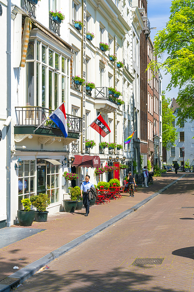 Man passing by Amsterdam House Hotel, Amsterdam, The Netherlands, Europe