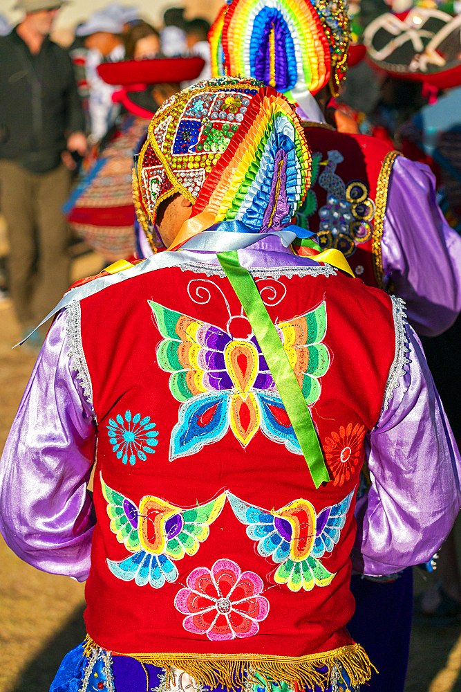 Back view of Peruvian man in traditional dress on celebration, Chinchero, Peru, South America