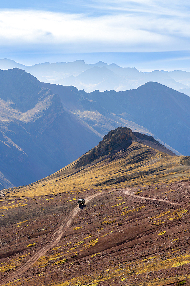 Tuk tuk on mountain road in Andean mountains near Rainbow mountain, Pitumarca District, Cuzco Region, Peru