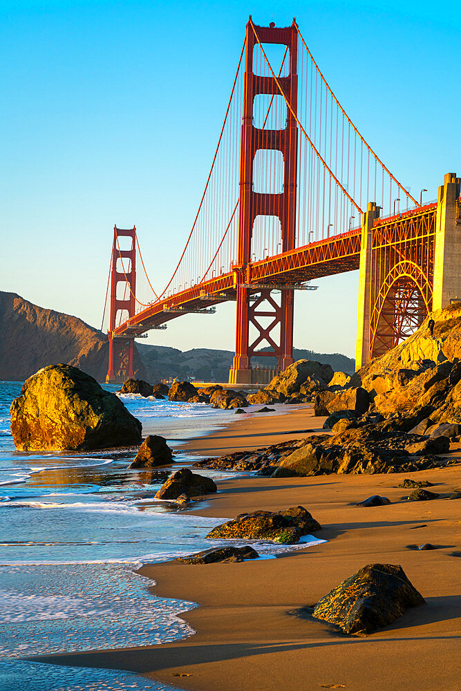 Golden Gate bridge seen from Marshall beach at sunset, San Francisco, California, USA