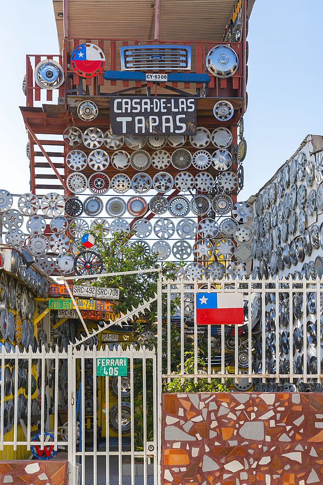 House decorated with car wheel covers named Casa de las Tapas, Cerro Bellavista, Valparaiso, Valparaiso Province, Valparaiso Region, Chile, South America