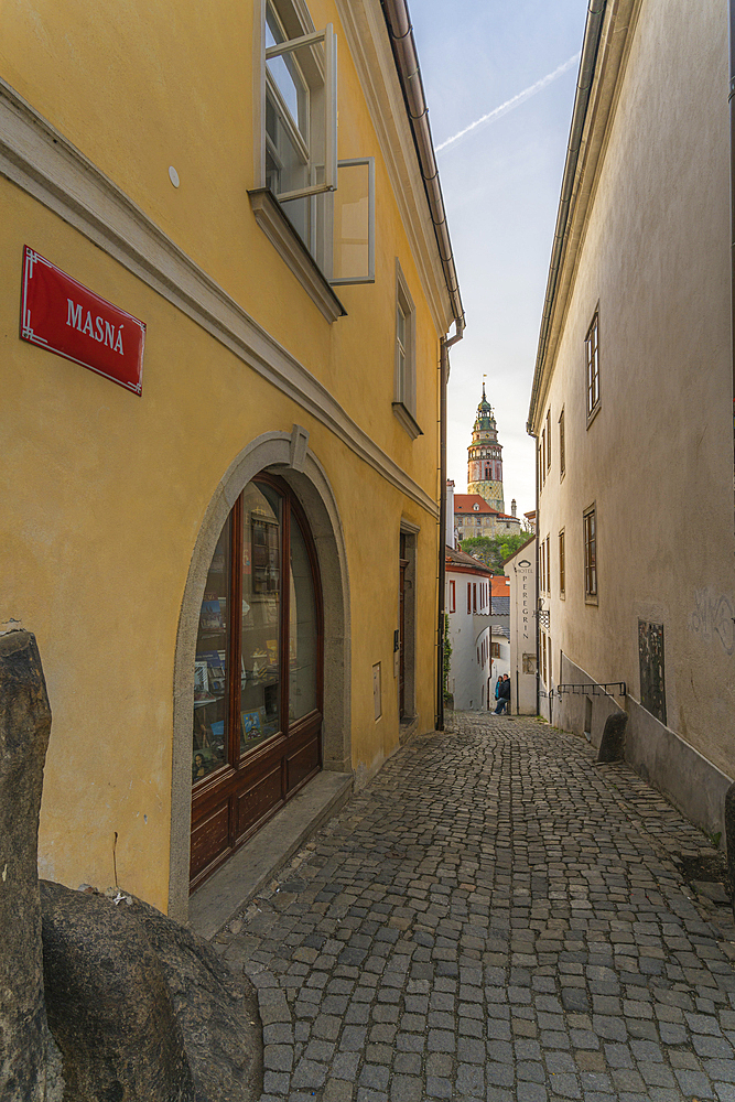 State Castle and Chateau Cesky Krumlov tower seen from narrow Masna street, UNESCO World Heritage Site, Cesky Krumlov, South Bohemian Region, Czech Republic (Czechia), Europe