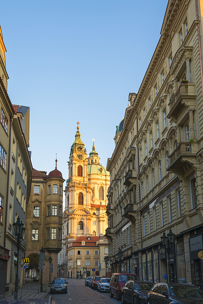 Illuminated St. Nicholas Church at sunrise, Mala Strana, UNESCO World Heritage Site, Prague, Bohemia, Czech Republic (Czechia), Europe