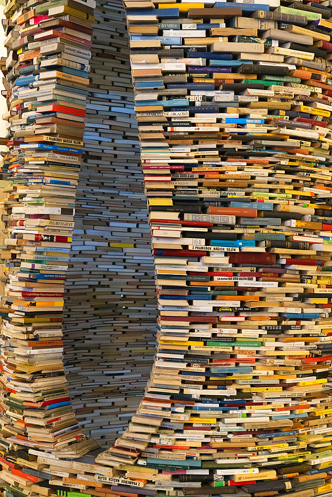 Artwork named Idiom designed by Matej Kren in 1998, a book tunnel of 8000 books at the Municipal Library of Prague, Prague, Czech Republic (Czechia), Europe