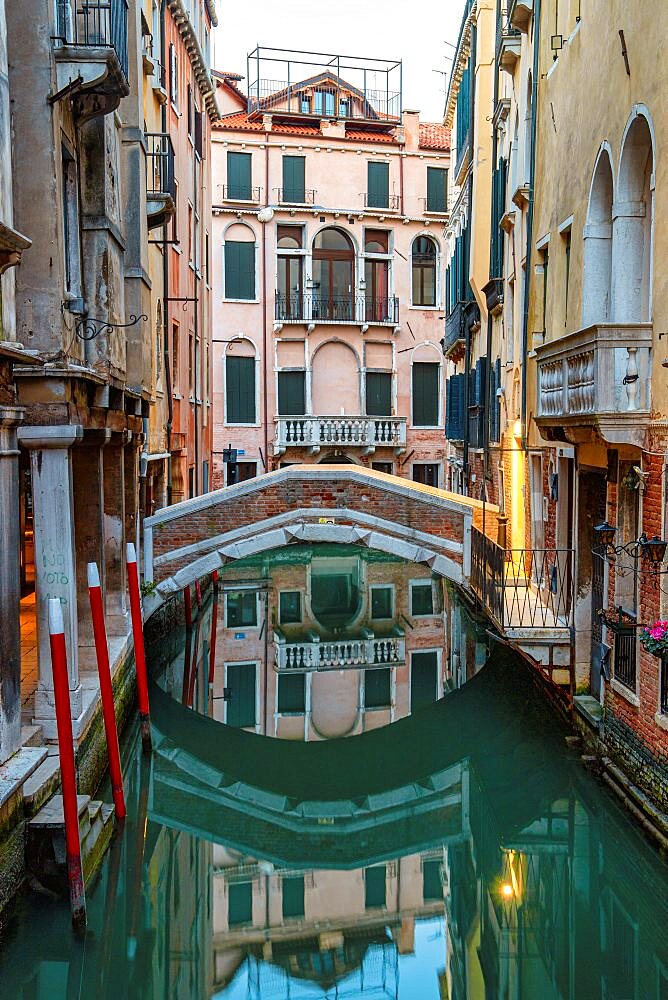 Reflections of houses and bridge in the canal, Sestiere San Marco, Venice, Veneto, Italy