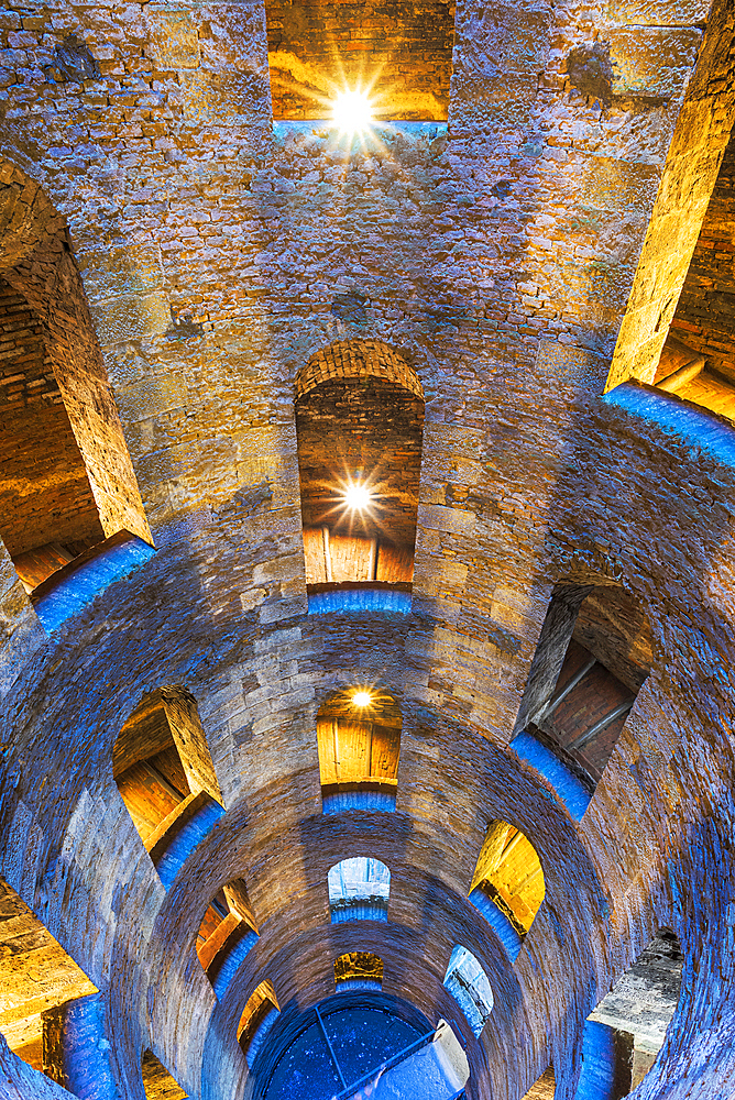 Illuminated view of the bottom of Saint Patrick's well with a spiral staircase, Orvieto, Terni province, Umbria region, Italy, Europe