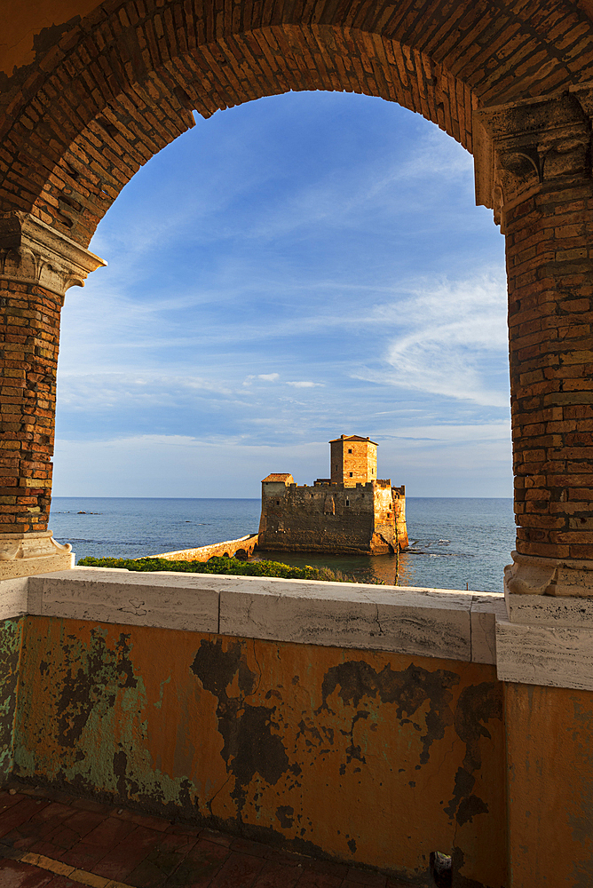 Torre Astura medieval castle seen from an arch made of bricks, Tyrrhenian Sea, Rome province, Latium (Lazio), Italy, Europe