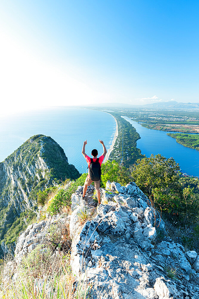 Rear view of a man enjoying the view towards the peak of Circeo, Circeo National Park, Latina province, Latium (Lazio), Italy, Europe