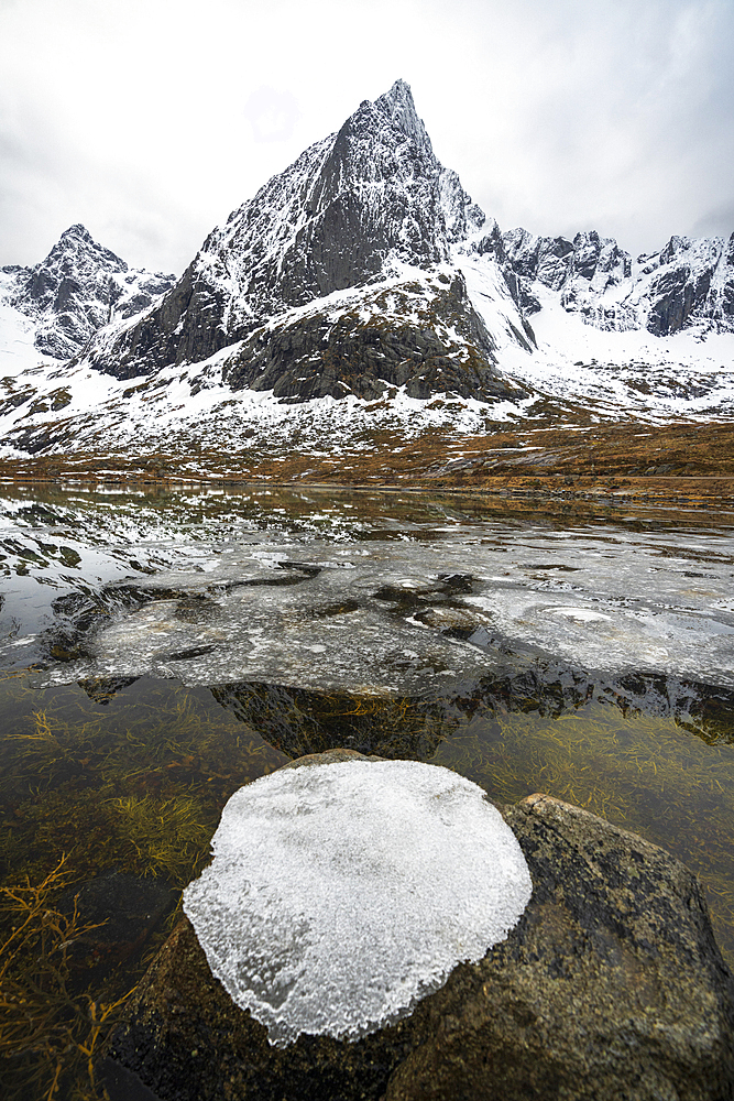 Ice formation on top of a rock in the Arctic landscape, Flakstadoya, Nordland, Lofoten Islands, Norway, Scandinavia, Europe